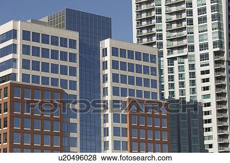 Stock Photo - USA, New York, New York City, Modern skyscrapers and blue sky above. Fotosearch