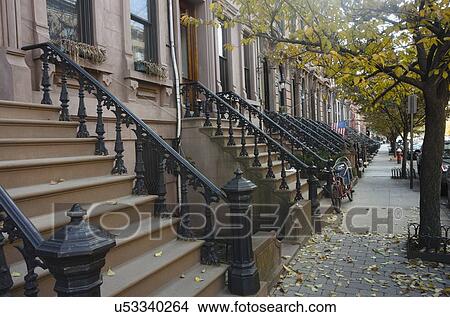 Picture - USA, New York State, New York City, Empty sidewalk along apartment buildings. Fotosearch