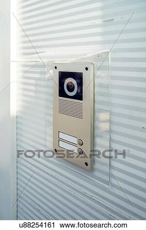 Stock Image - Video intercom device on building exterior wall.. Fotosearch