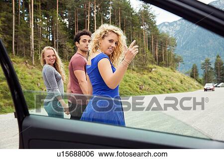 View through car window of friends looking over shoulder at camera, Innsbruck, Tirol, Austria, Europe View Large Photo Image Stock Photograph - View through car window of friends looking over shoulder at camera, Innsbruck, Tirol, Austria, Europe. Fotosearch