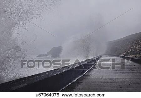 Stock Photography - Water crashing against sea wall, Seaham Harbour, Durham, UK. Fotosearch
