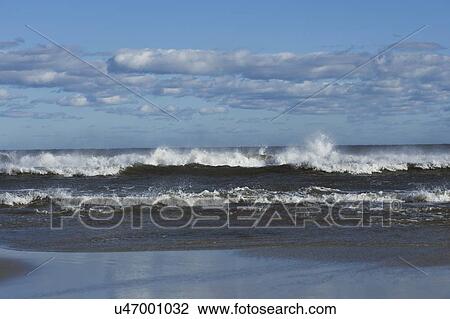 Waves splashing onto beach View Large Photo Image Stock Image - Waves splashing onto beach. Fotosearch