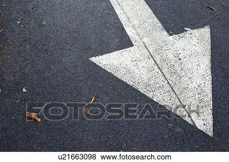 Stock Photo - White arrow on asphalt road.. Fotosearch