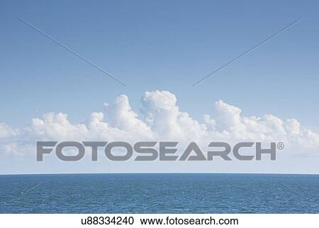 White cumulus clouds above blue Atlantic Ocean View Large Photo Image Stock Image - White cumulus clouds above blue Atlantic Ocean. Fotosearch