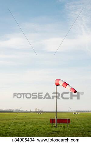 Picture - Wind sock on Midden-Zeeland airfield, Arnemuiden, Zeeland, Netherlands. Fotosearch