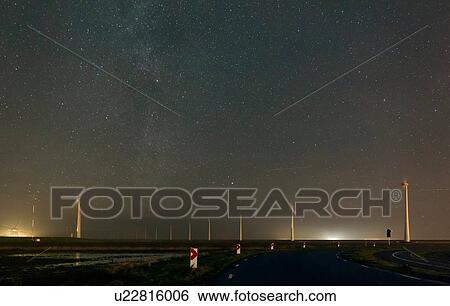Wind turbines in the polder beside Eemshaven harbour and industrial area, Delfzijl, Groningen, Netherlands View Large Photo Image Stock Photograph - Wind turbines in the polder beside Eemshaven harbour and industrial area, Delfzijl, Groningen, Netherlands. Fotosearch
