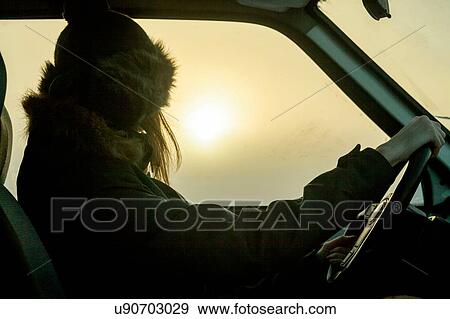 Woman behind wheel of car View Large Photo Image Stock Photo - Woman behind wheel of car. Fotosearch