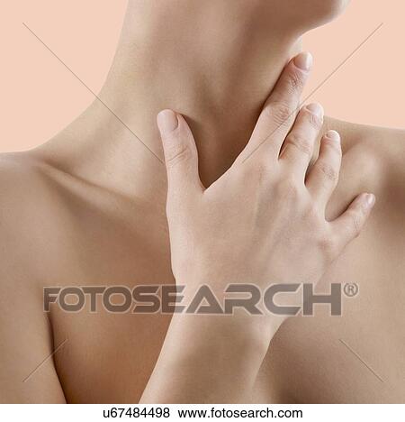 Stock Photo - Woman checking her glands.. Fotosearch