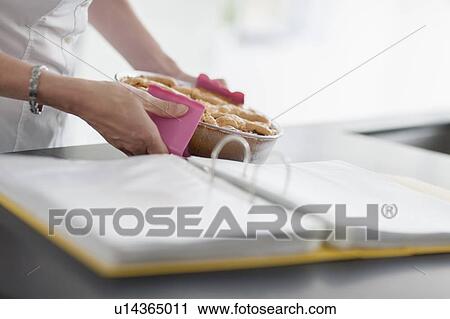 Woman holding hot casserole dish View Large Photo Image Stock Image - Woman holding hot casserole dish. Fotosearch
