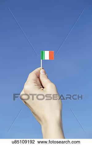 Woman holding Italian flag in hand View Large Photo Image Stock Image - Woman holding Italian flag in hand. Fotosearch