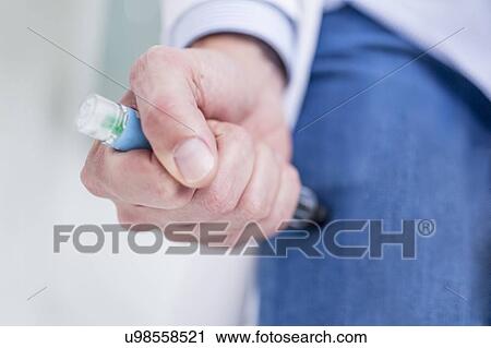 Woman injecting herself in the thigh. View Large Photo Image Stock Image - Woman injecting herself in the thigh.. Fotosearch