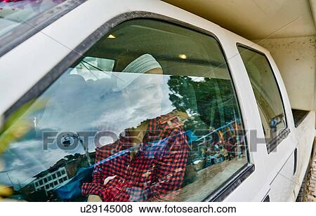 Woman inside recreational vehicle, looking out of window, Copacabana, Oruro, Bolivia, South America View Large Photo Image Stock Photo - Woman inside recreational vehicle, looking out of window, Copacabana, Oruro, Bolivia, South America. Fotosearch