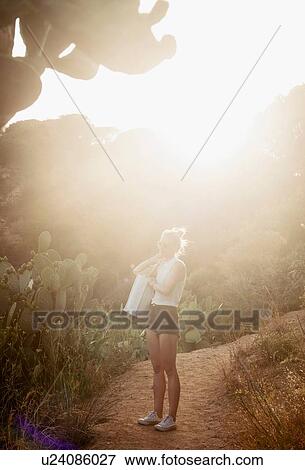 Woman looking at view from rural pathway, Tossa de mar, Catalonia, Spain View Large Photo Image Stock Photo - Woman looking at view from rural pathway, Tossa de mar, Catalonia, Spain. Fotosearch