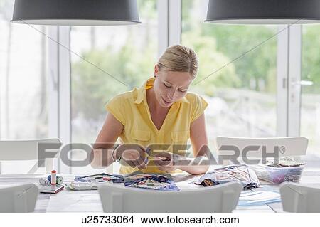 Woman making quilt View Large Photo Image Picture - Woman making quilt. Fotosearch
