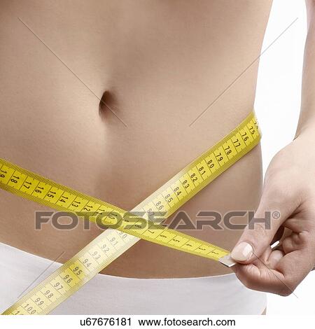 Woman measuring waist. View Large Photo Image Stock Image - Woman measuring waist.. Fotosearch