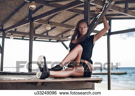 Woman on bar top of cabana at seaside, Odessa, Odes'ka Oblast', Ukraine View Large Photo Image Stock Photograph - Woman on bar top of cabana at seaside, Odessa, Odes'ka Oblast', Ukraine. Fotosearch