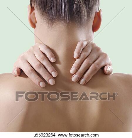Woman rubbing her neck. View Large Photo Image Picture - Woman rubbing her neck.. Fotosearch