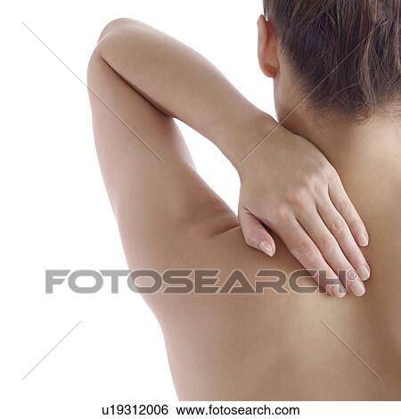 Woman rubbing her shoulder. View Large Photo Image Stock Photograph - Woman rubbing her shoulder.. Fotosearch