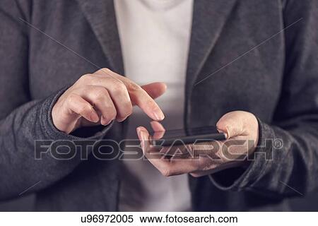 Stock Photography - Woman using mobile phone.. Fotosearch
