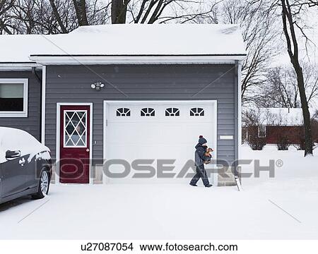 Picture - Woman watching boy with dog outdoors. Fotosearch