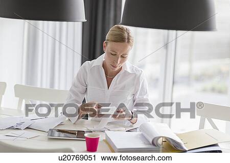 Woman working from home View Large Photo Image Stock Image - Woman working from home. Fotosearch