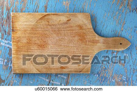 Wooden board on kitchen table, top view. View Large Photo Image Stock Photograph - Wooden board on kitchen table, top view.. Fotosearch