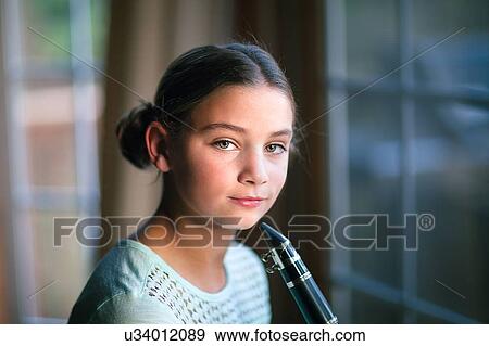 Young clarinettist posing with her clarinet View Large Photo Image Stock Photo - Young clarinettist posing with her clarinet. Fotosearch