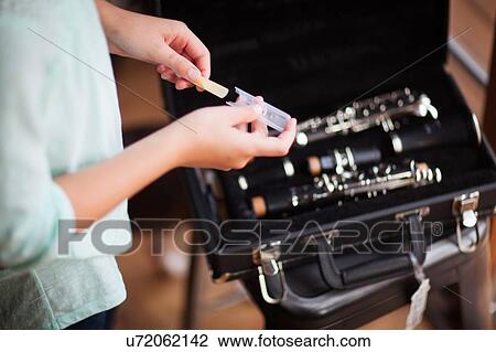 Young clarinettist putting her clarinet in case View Large Photo Image Stock Image - Young clarinettist putting her clarinet in case. Fotosearch