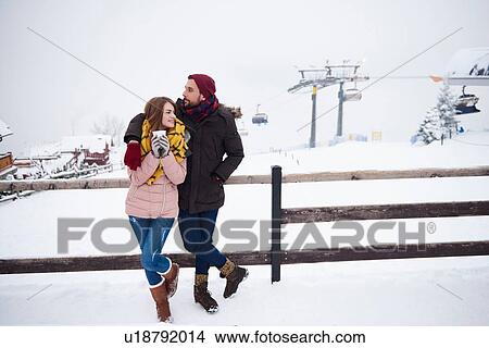 Picture - Young couple relaxing by ski resort, Zakopane, Malopolskie, Poland. Fotosearch