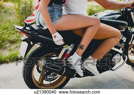 Young couple riding motorcycle on rural road, Krabi, Thailand, waist down View Large Photo Image Stock Image - Young couple riding motorcycle on rural road, Krabi, Thailand, waist down. Fotosearch