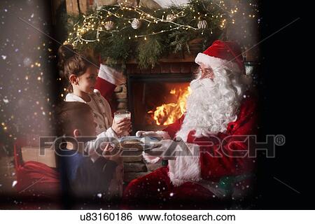 Young girl and boy giving milk and cookies to Santa View Large Photo Image Stock Photograph - Young girl and boy giving milk and cookies to Santa. Fotosearch