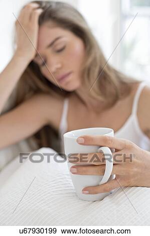 Young woman in bed with coffee. View Large Photo Image Stock Photo - Young woman in bed with coffee.. Fotosearch