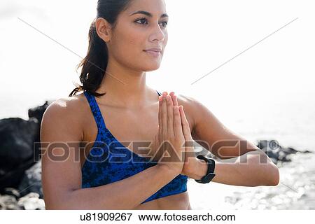 Young woman practicing yoga meditating on beach, Las Palmas, Canary Islands, Spain View Large Photo Image Stock Photo - Young woman practicing yoga meditating on beach, Las Palmas, Canary Islands, Spain. Fotosearch