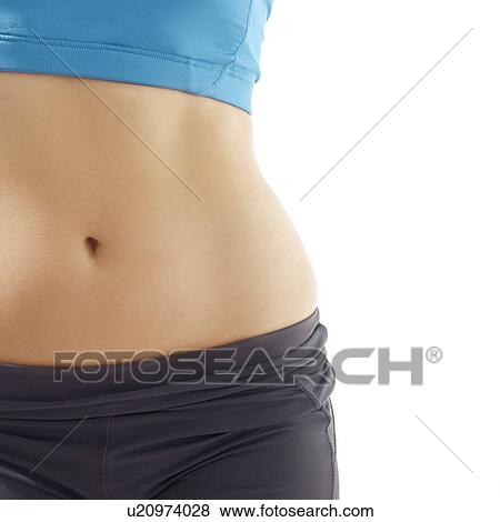 Young woman wearing sports clothing, studio shot. View Large Photo Image Stock Photo - Young woman wearing sports clothing, studio shot.. Fotosearch
