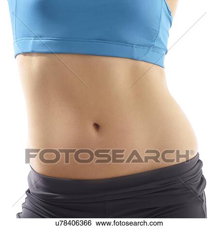 Young woman wearing sports clothing, studio shot. View Large Photo Image Stock Photograph - Young woman wearing sports clothing, studio shot.. Fotosearch