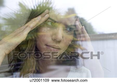 Young woman with hands on head. View Large Photo Image Stock Photo - Young woman with hands on head.. Fotosearch