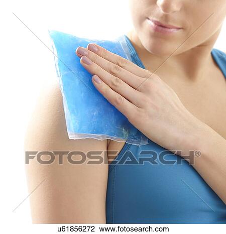 Young woman with ice pack on her shoulder, studio shot. View Large Photo Image Stock Image - Young woman with ice pack on her shoulder, studio shot.. Fotosearch