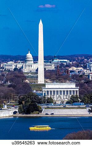 Aerial view of Washington D. C. from Top of Town restaurant, Arlington, Virginia shows Lincoln & Washington Memorial and U. S. Capitol with tour boat and Potomac River in foreground View Large Photo Image Stock Image - Aerial view of Washington D. C. from Top of Town restaurant, Arlington, Virginia shows Lincoln & Washington Memorial and U. S. Capitol with tour boat and Potomac River in foreground. Fotosearch