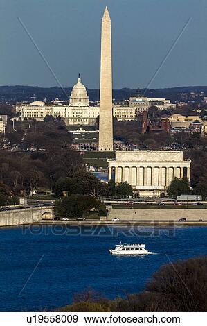 Aerial view of Washington D. C. from Top of Town restaurant, Arlington, Virginia shows Lincoln & Washington Memorial and U. S. Capitol with tour boat and Potomac River in foreground View Large Photo Image Stock Photo - Aerial view of Washington D. C. from Top of Town restaurant, Arlington, Virginia shows Lincoln & Washington Memorial and U. S. Capitol with tour boat and Potomac River in foreground. Fotosearch