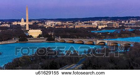 Stock Photography - Aerial view of Washington D. C. from Top of Town restaurant, Arlington, Virginia shows Lincoln & Washington Memorial and U. S. Capitol and Memorial Bridge crossing Potomac River. Fotosearch