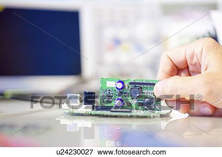 Assembling electronics device. View Large Photo Image Stock Photo - Assembling electronics device.. Fotosearch