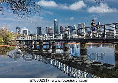 Stock Photo - AUSTIN SKYLINE AND LADY BIRD LAKE - Austin Texas skyline. The Boardwalk Trail at Lady Bird Lake. Fotosearch