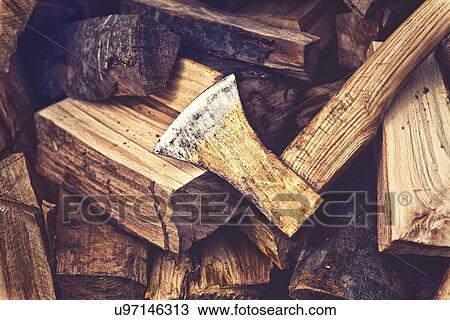 Stock Image - Axe and logs.. Fotosearch