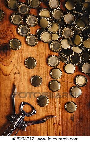 Beer bottle tops and opener. View Large Photo Image Stock Image - Beer bottle tops and opener.. Fotosearch