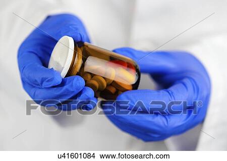 Picture - Bottle of unlabelled pills.. Fotosearch