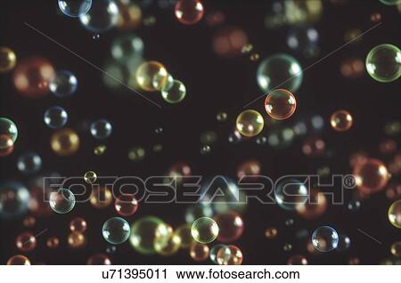 Stock Image - Bubbles against black background, illustration.. Fotosearch