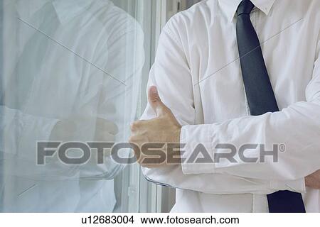 Businessman giving thumbs up. View Large Photo Image Picture - Businessman giving thumbs up.. Fotosearch