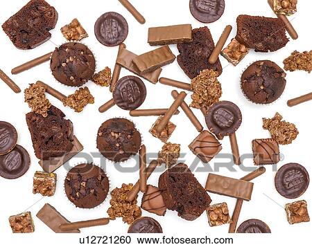 Stock Image - Cakes and biscuits against a white background.. Fotosearch