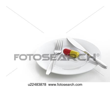 Stock Photo - Capsule on dinner plate, studio shot.. Fotosearch