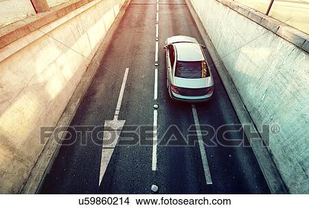 Picture - Car exiting underpass.. Fotosearch